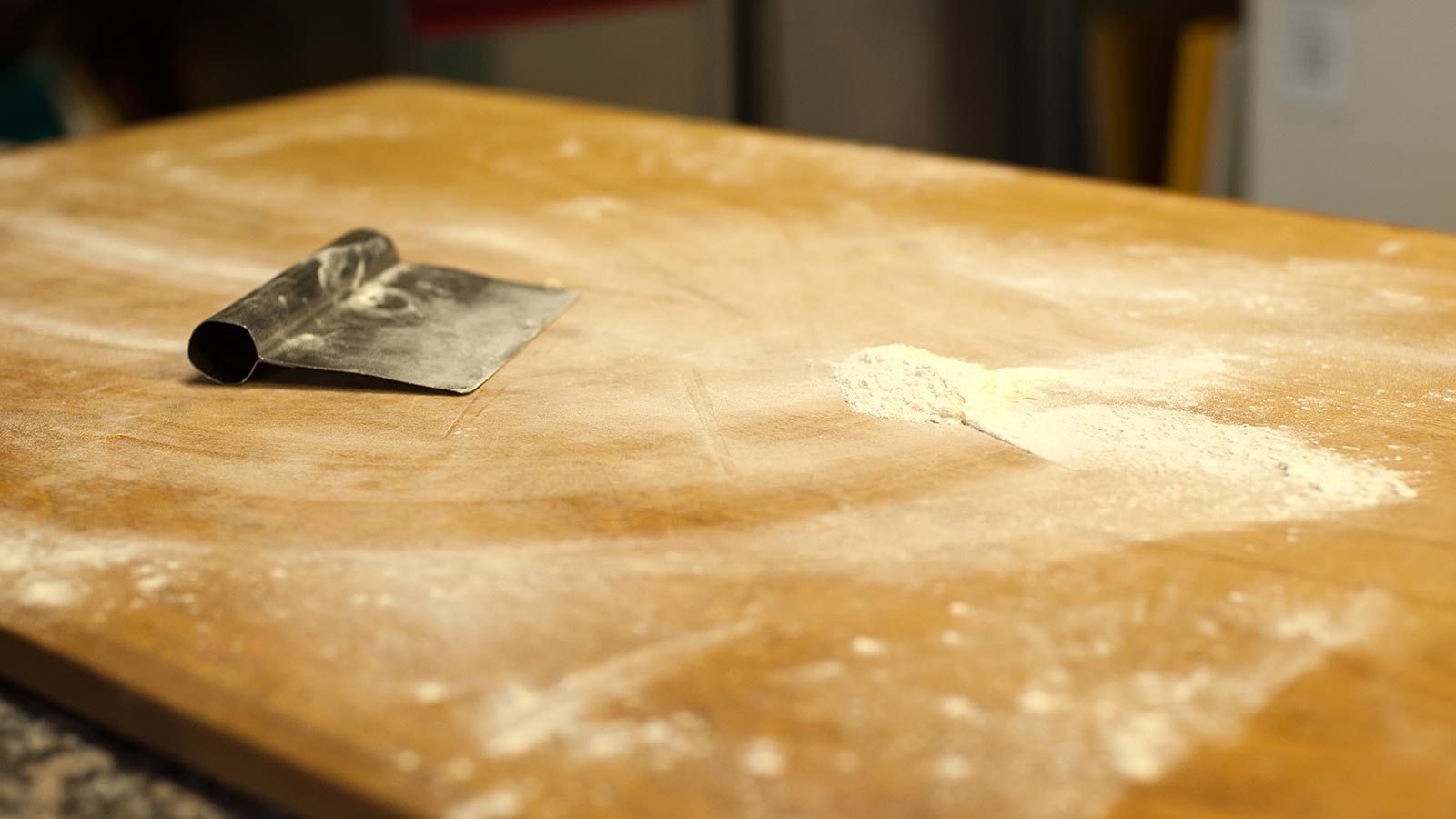 A work surface covered in flour ready for baking bread